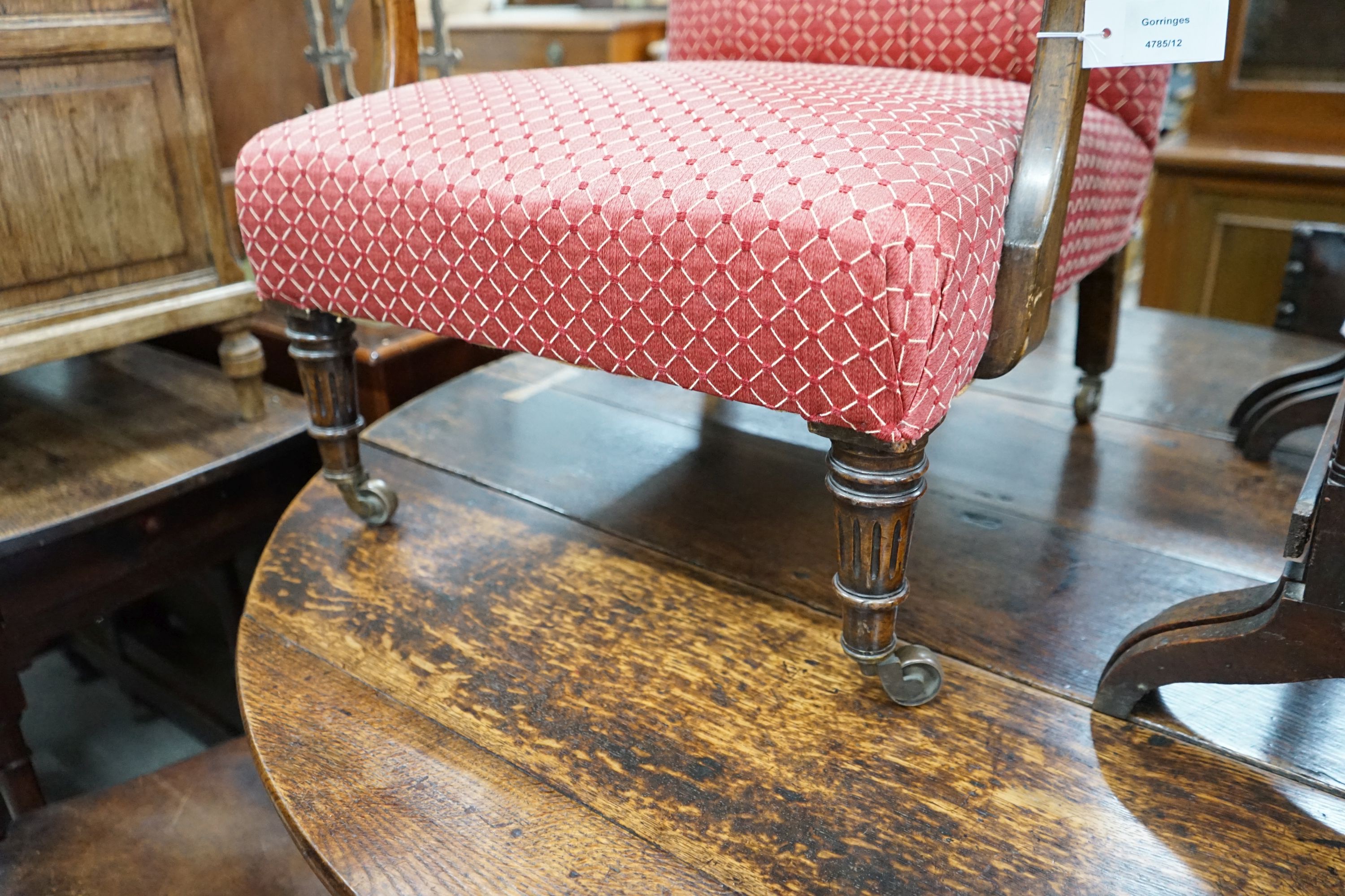 A Victorian mahogany upholstered armchair, width 64cm, depth 60cm, height 80cm